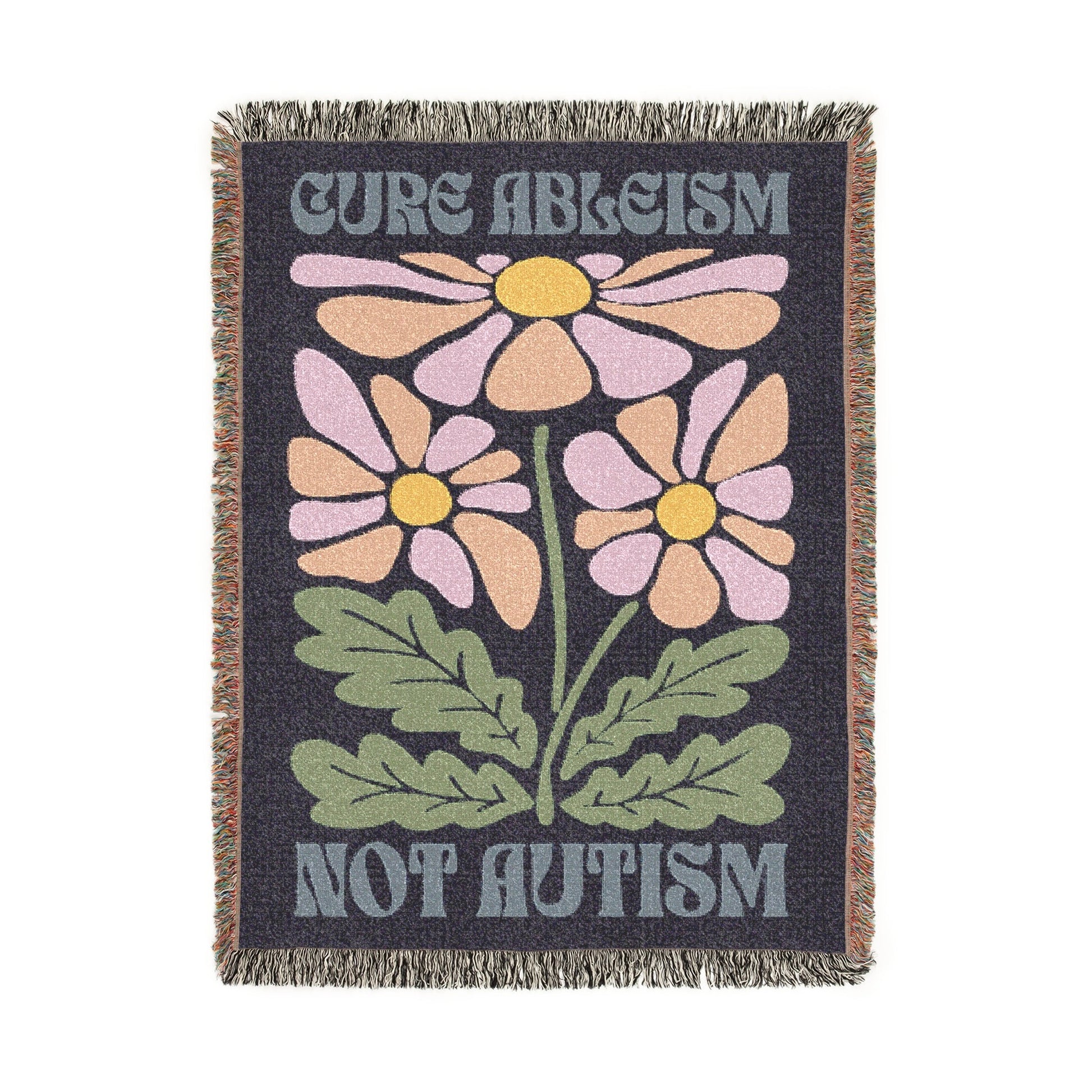 Blanket with floral design and text 'Cure Ableism Not Autism' on a white background