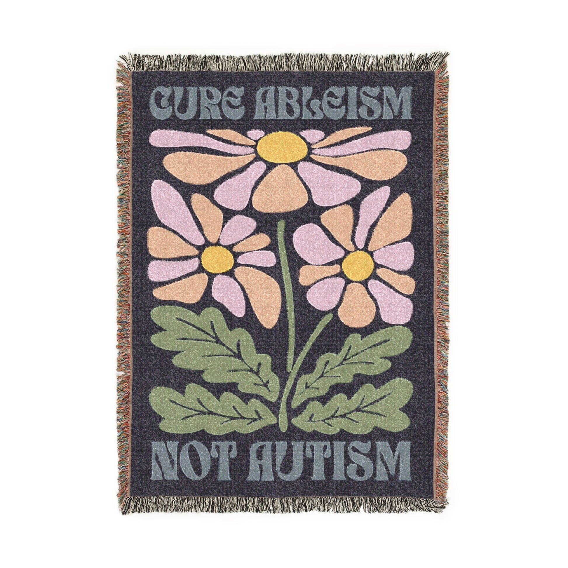 Blanket with floral design and text 'Cure Ableism Not Autism' on a white background